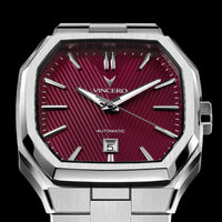 Silver wristwatch with a red face on a black background