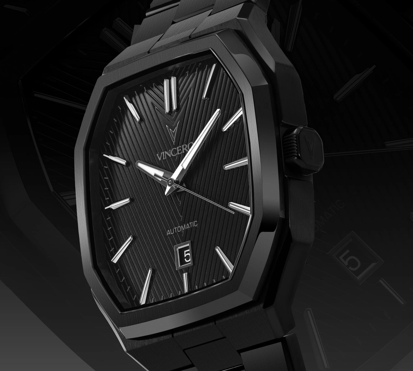 Black wristwatch with detailed face on a dark background