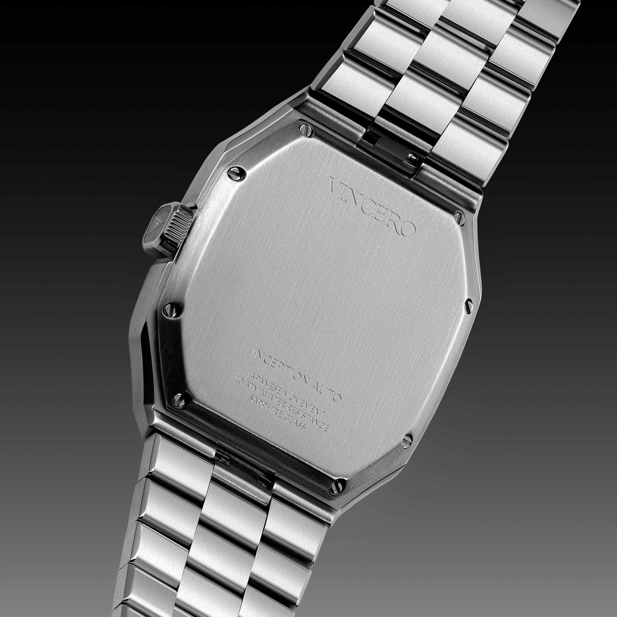Silver watch with metal strap on a dark background