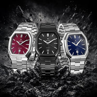Three watches with different face colors on a dark textured background