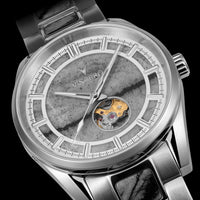 Silver watch with detailed face and visible brand name on a black background