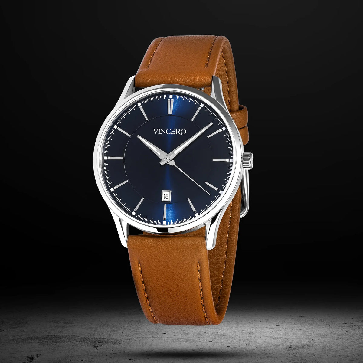 Watch with brown leather strap and blue dial on a dark background