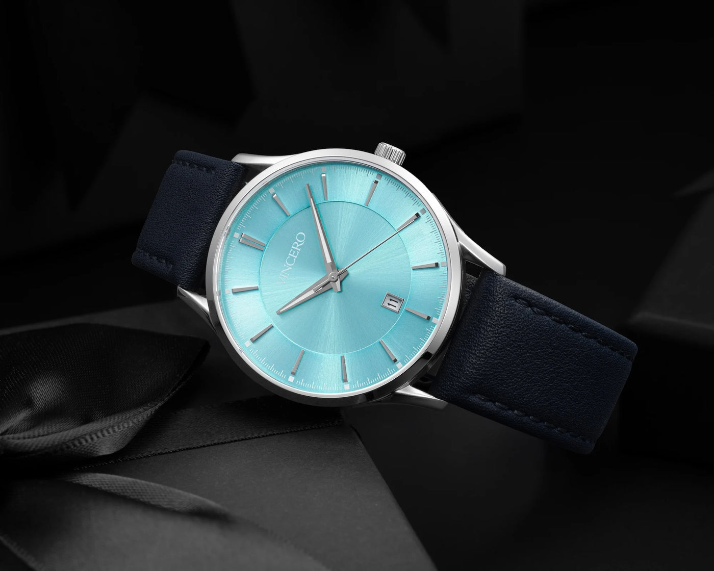 Chrono Limited Release watch, featuring a Carolina blue face, stainless steel case, and matching steel band, displayed on a black gift box.