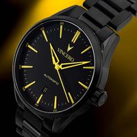 Black watch with yellow accents on a dark background