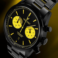 Black and yellow Vincero watch on a dark background
