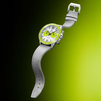 Wristwatch with a white strap and green face on a gradient background