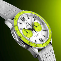 Watch with a green face and white strap on a gradient background