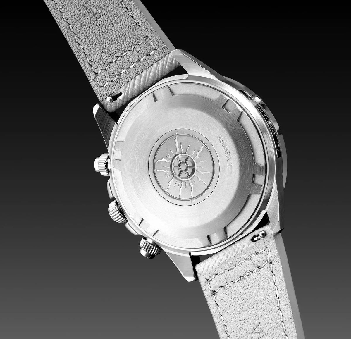 Watch with a gray leather strap on a dark background
