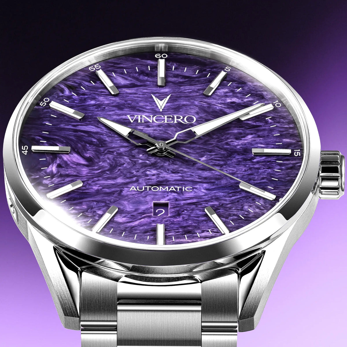 A close-up of a Vincero automatic wristwatch with a polished silver-tone stainless steel case and bracelet, featuring a textured purple dial with silver-tone indices and hands.