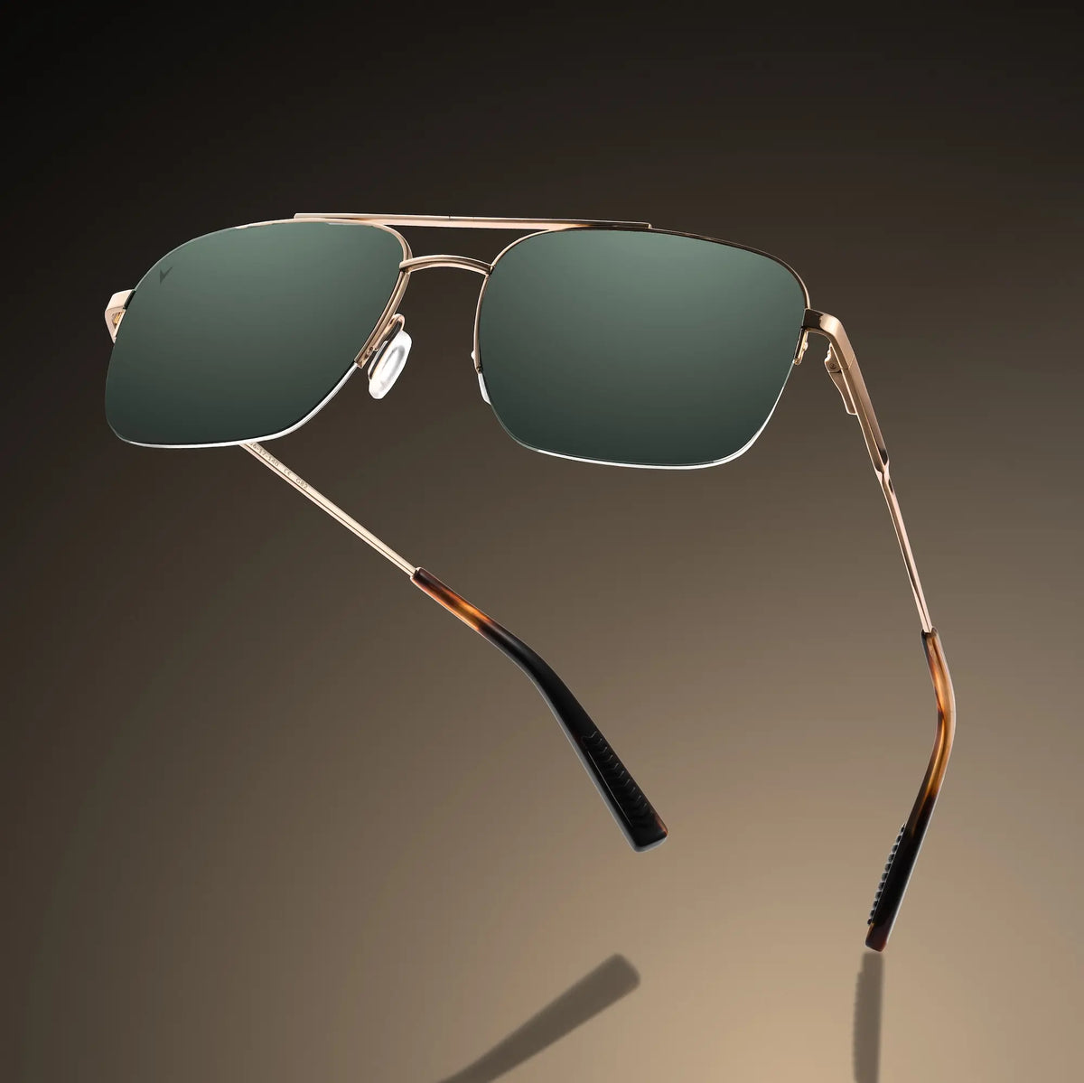 Aviator sunglasses with gold frame and green lenses on a gradient background
