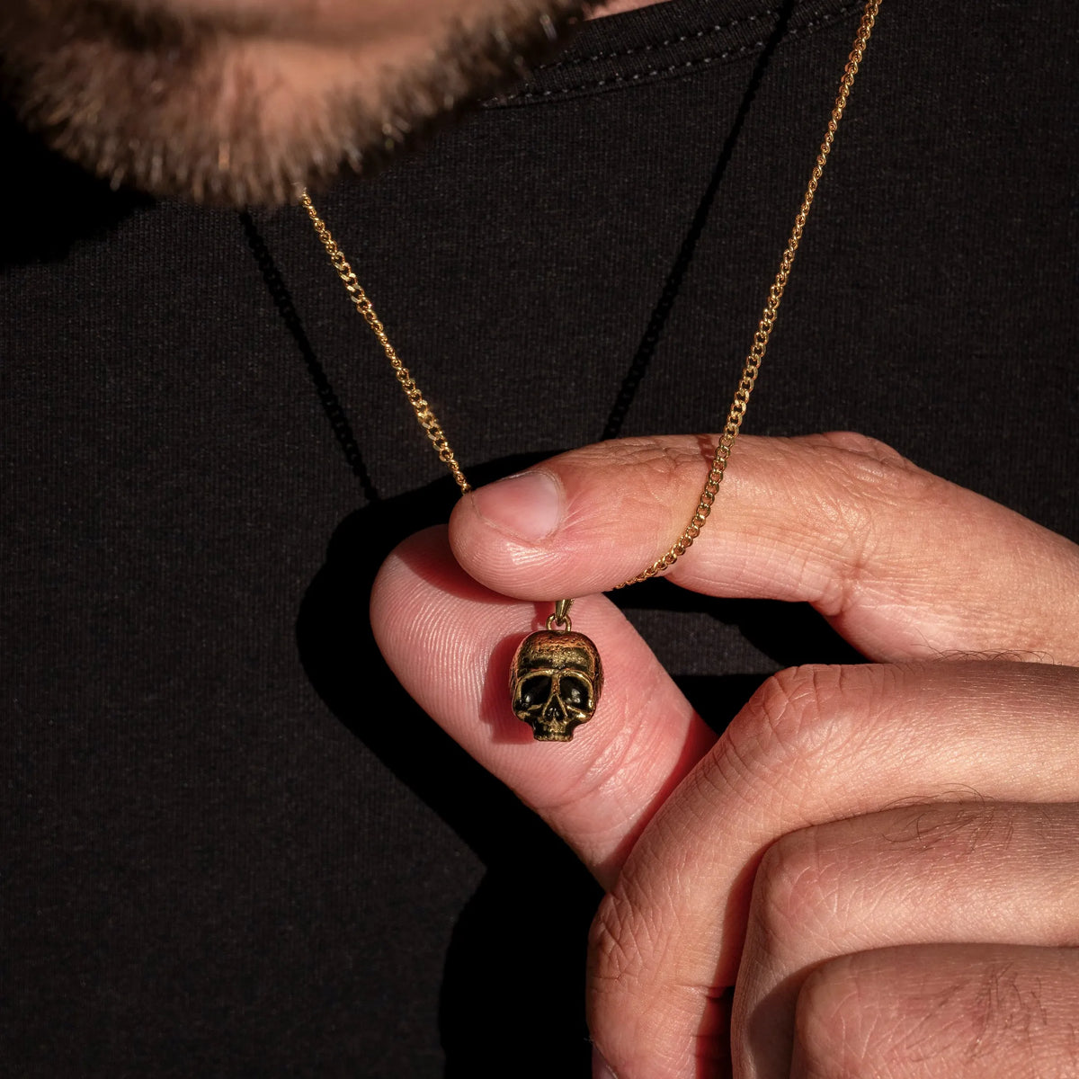 Gold momento mori skull pendant for men