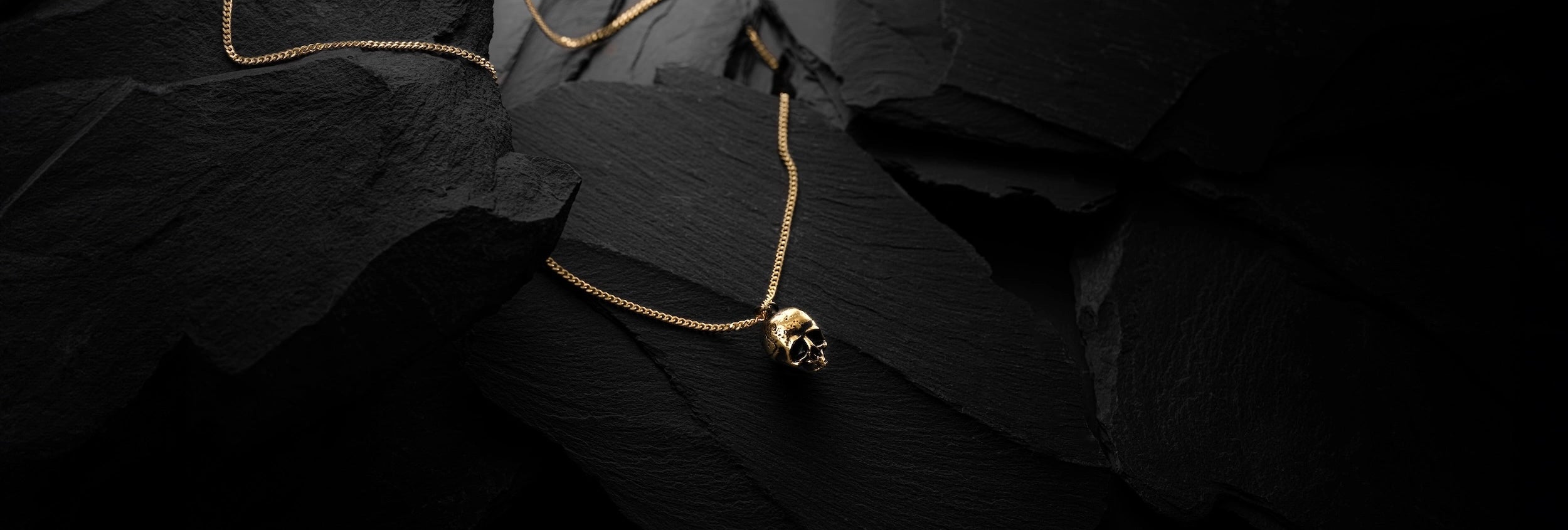 Gold momento mori skull pendant for men