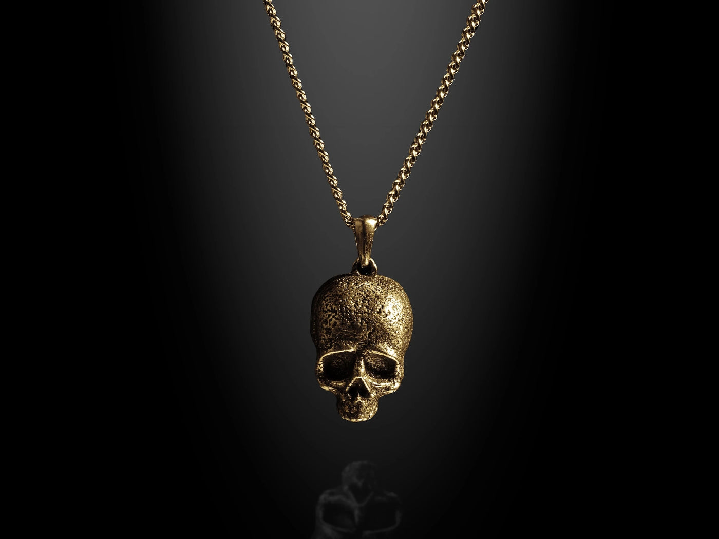 Gold momento mori skull pendant for men
