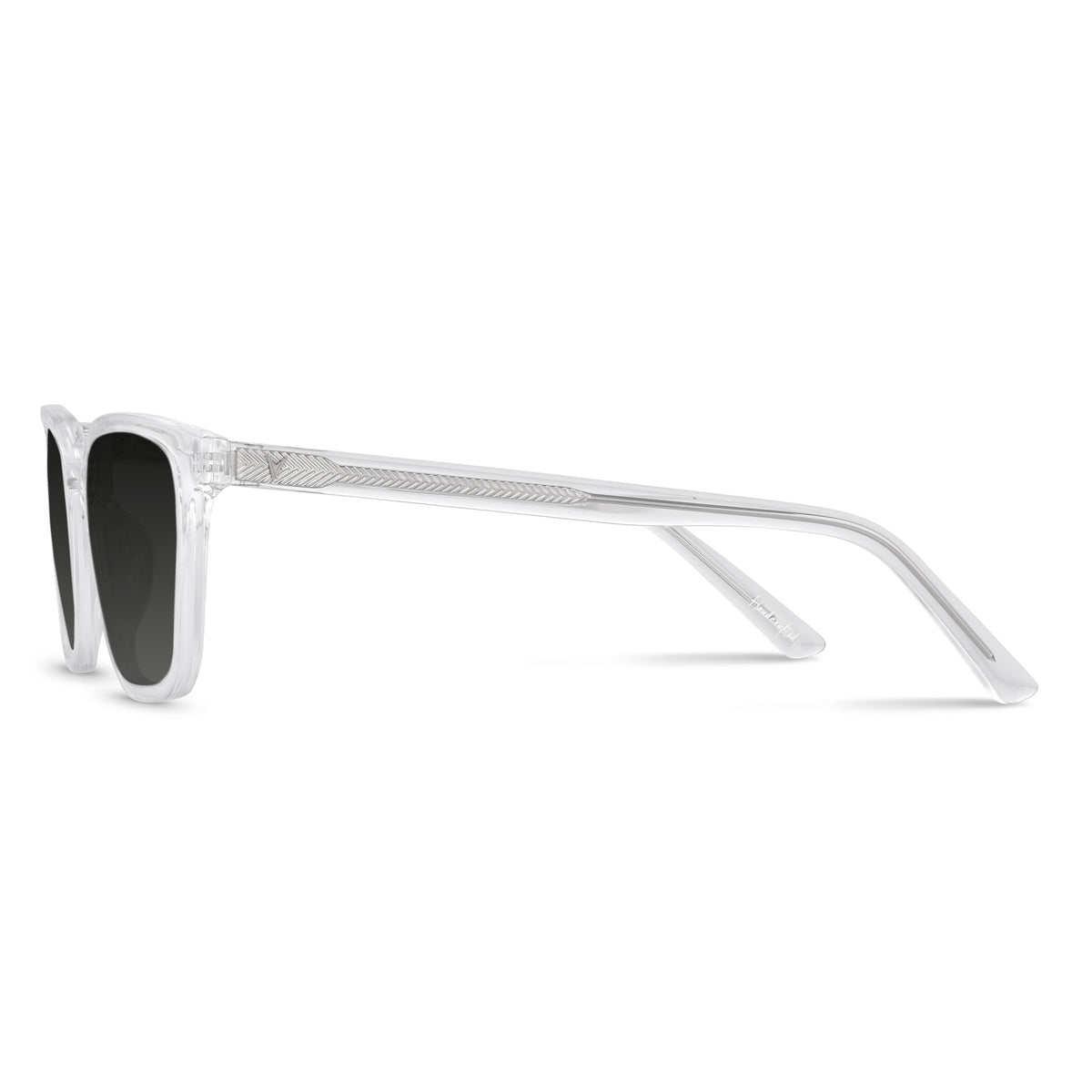 Sunglasses with a clear frame and black lenses on a white background