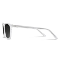 Sunglasses with a clear frame and black lenses on a white background