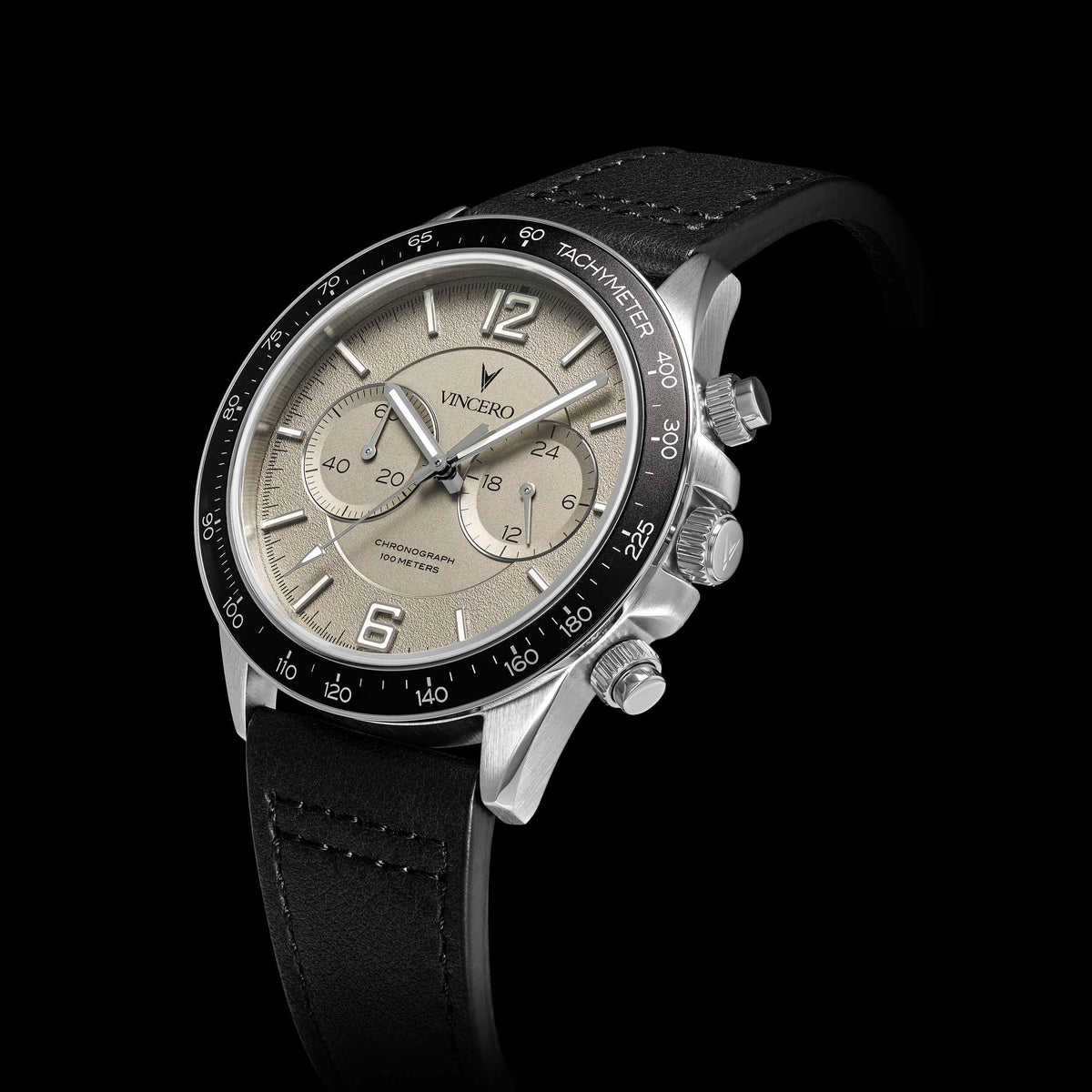 Watch with black strap and silver case on a black background