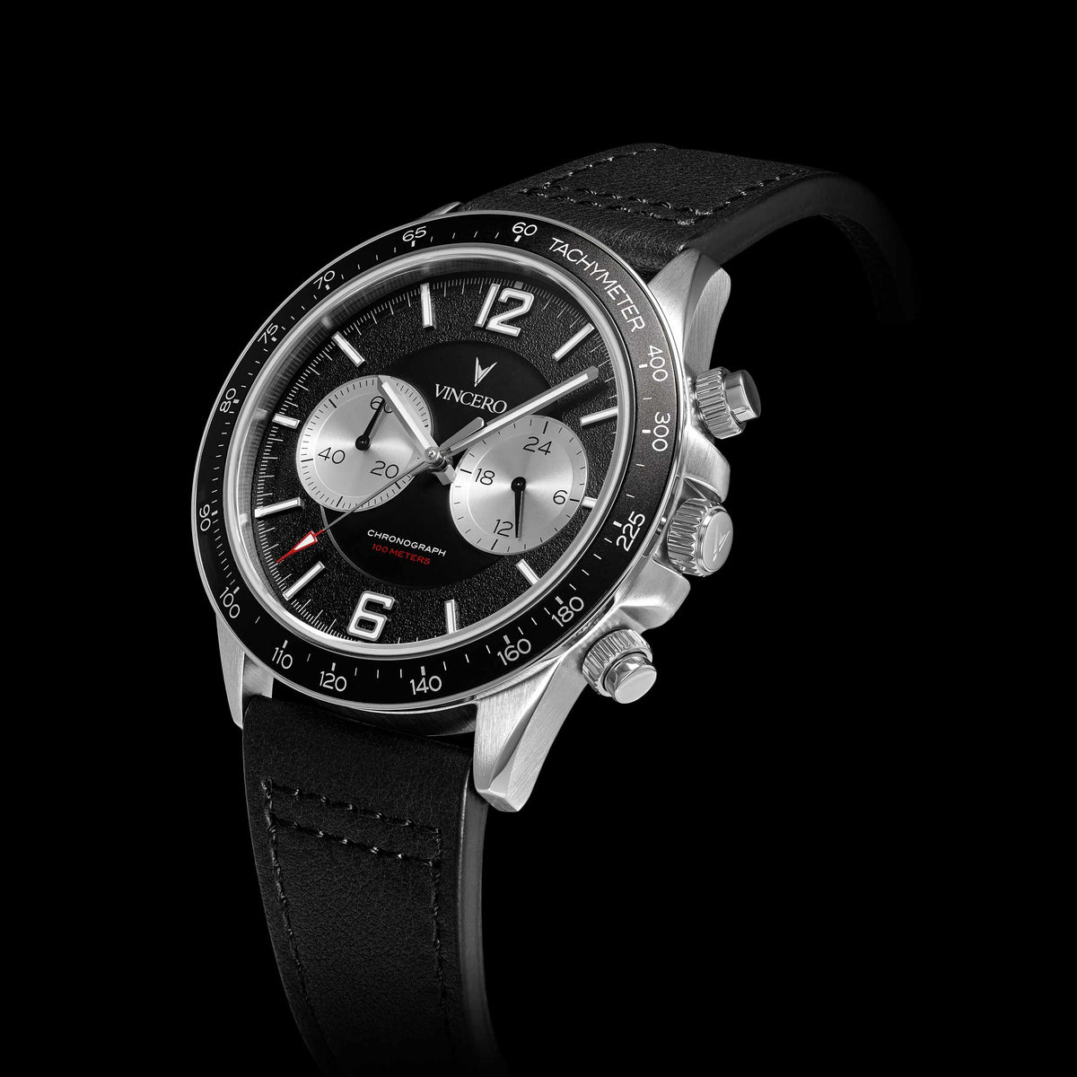 Black wristwatch with silver accents on a black background