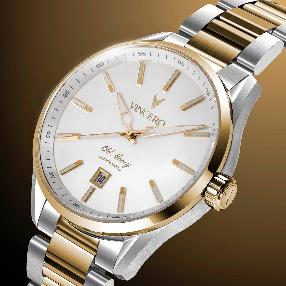 A close-up studio shot of a VINCERO men's automatic watch with a two-tone silver and gold stainless steel bracelet, a gold-tone bezel, and a white dial with gold indices.