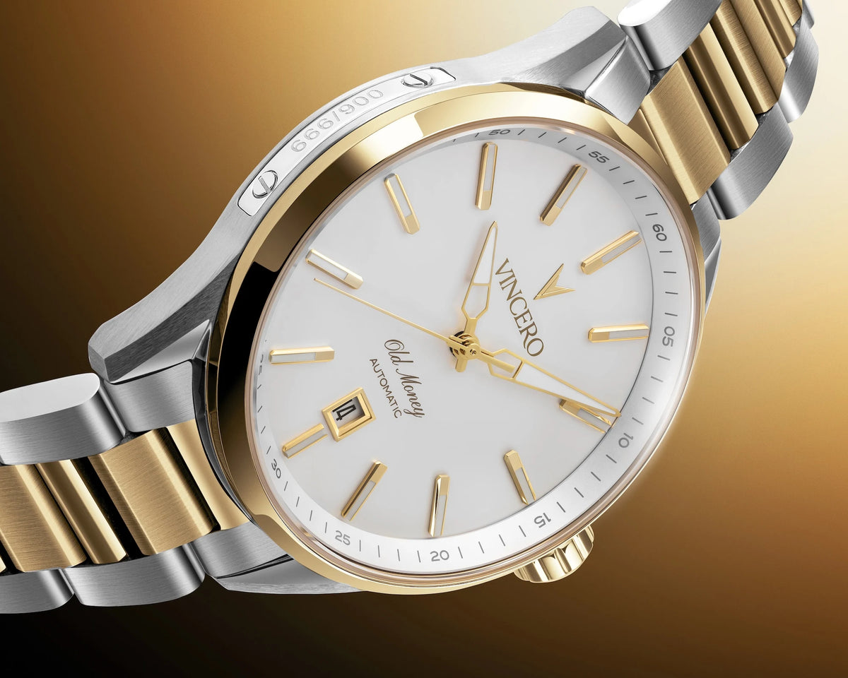 A Vancero men's automatic watch featuring a two-tone silver and gold stainless steel bracelet, a gold-tone inner bezel, and a white dial with gold-tone indices and a date window.