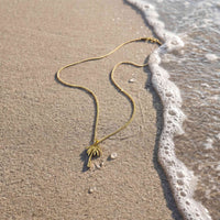 Palm Tree pendant for men lying on the sand 