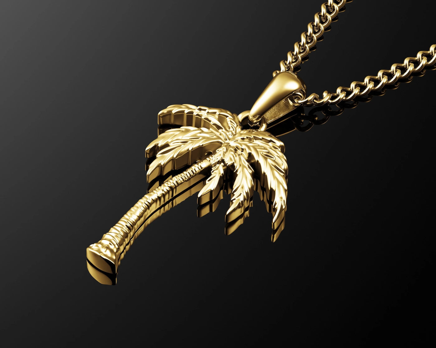 A gold-toned pendant necklace featuring a detailed palm tree charm, suspended from a matching curb chain against a dark gradient background.