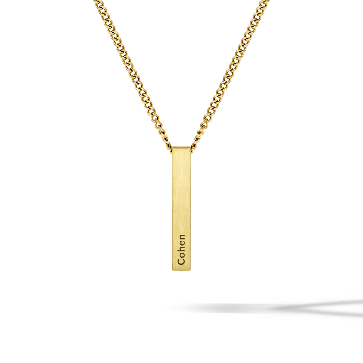 Gold necklace with a vertical bar pendant engraved with 'Cohen' on a white background