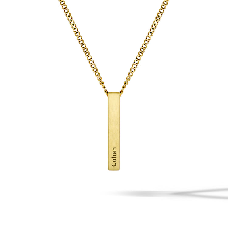 Gold necklace with a vertical bar pendant engraved with 'Cohen' on a white background