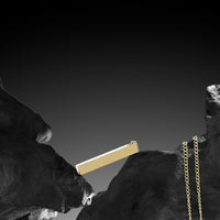 Gold bar and chain on a black background