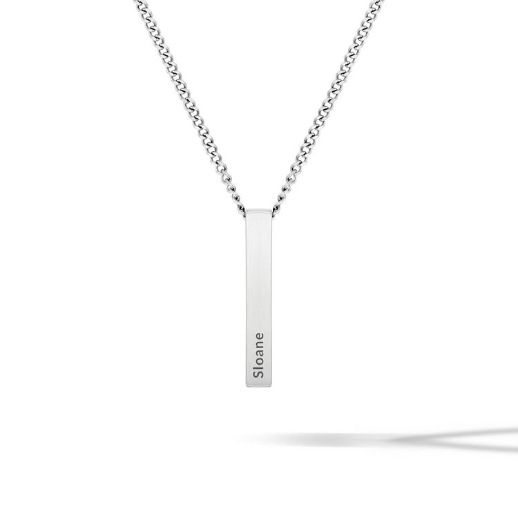 Silver necklace with a bar pendant on a white background