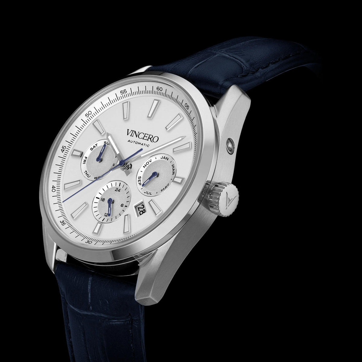Vincero watch with blue strap and silver case on a black background