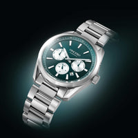 A silver stainless steel wristwatch with a dark green dial and three white subdials, branded VINCERO, shown on a dark gradient background.