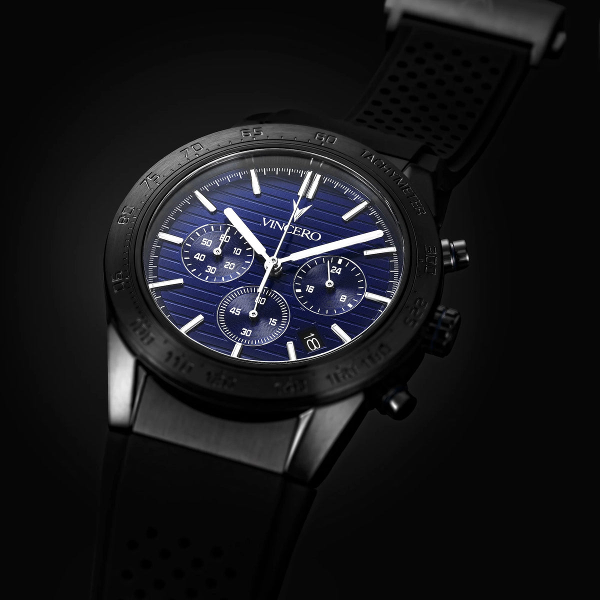 Black wristwatch with blue dial on a black background