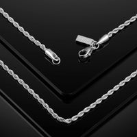Silver rope chain necklace with clasp on a black background