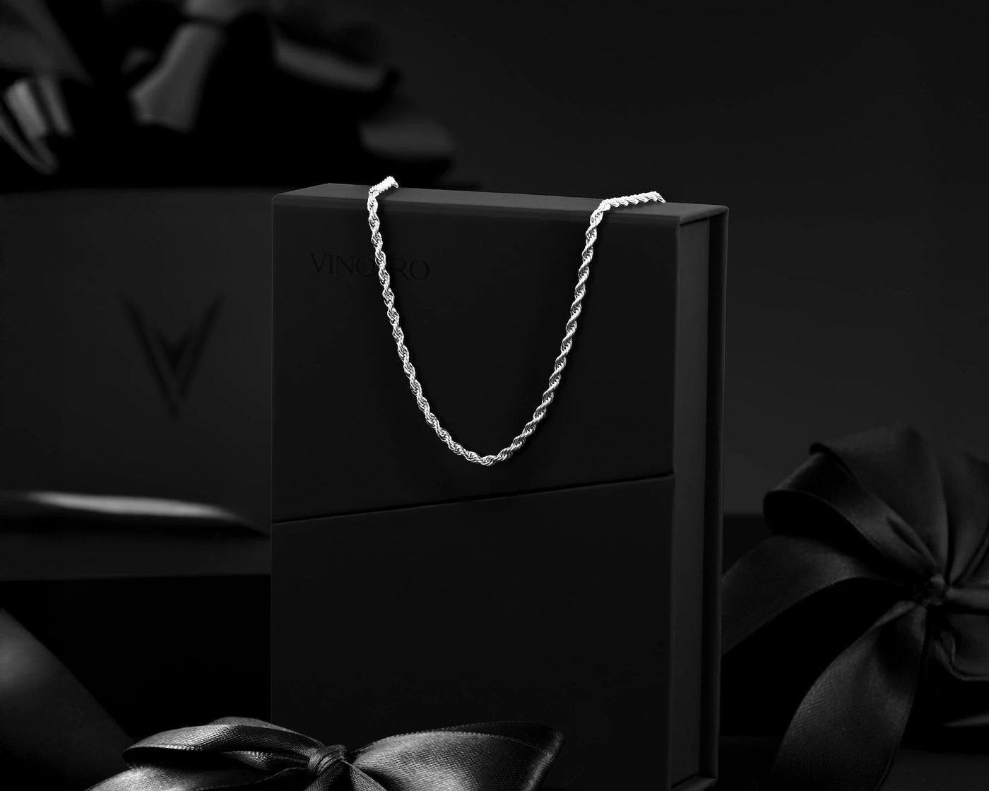 Black box with a silver chain on a dark background
