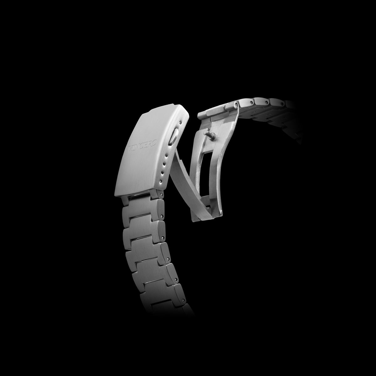 White metal watch strap on a black background