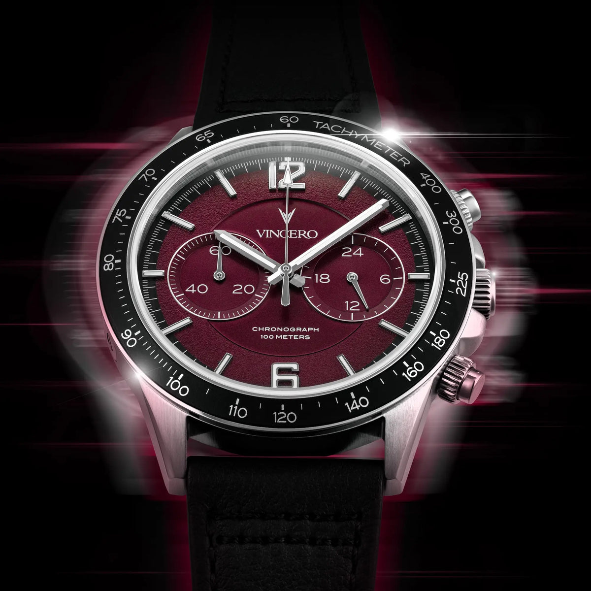 Watch with a maroon face and black strap on a dark background
