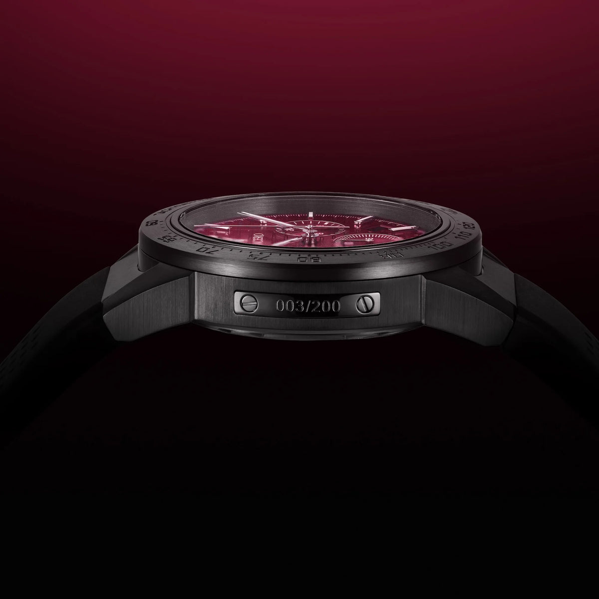 Black watch with red face on a dark background