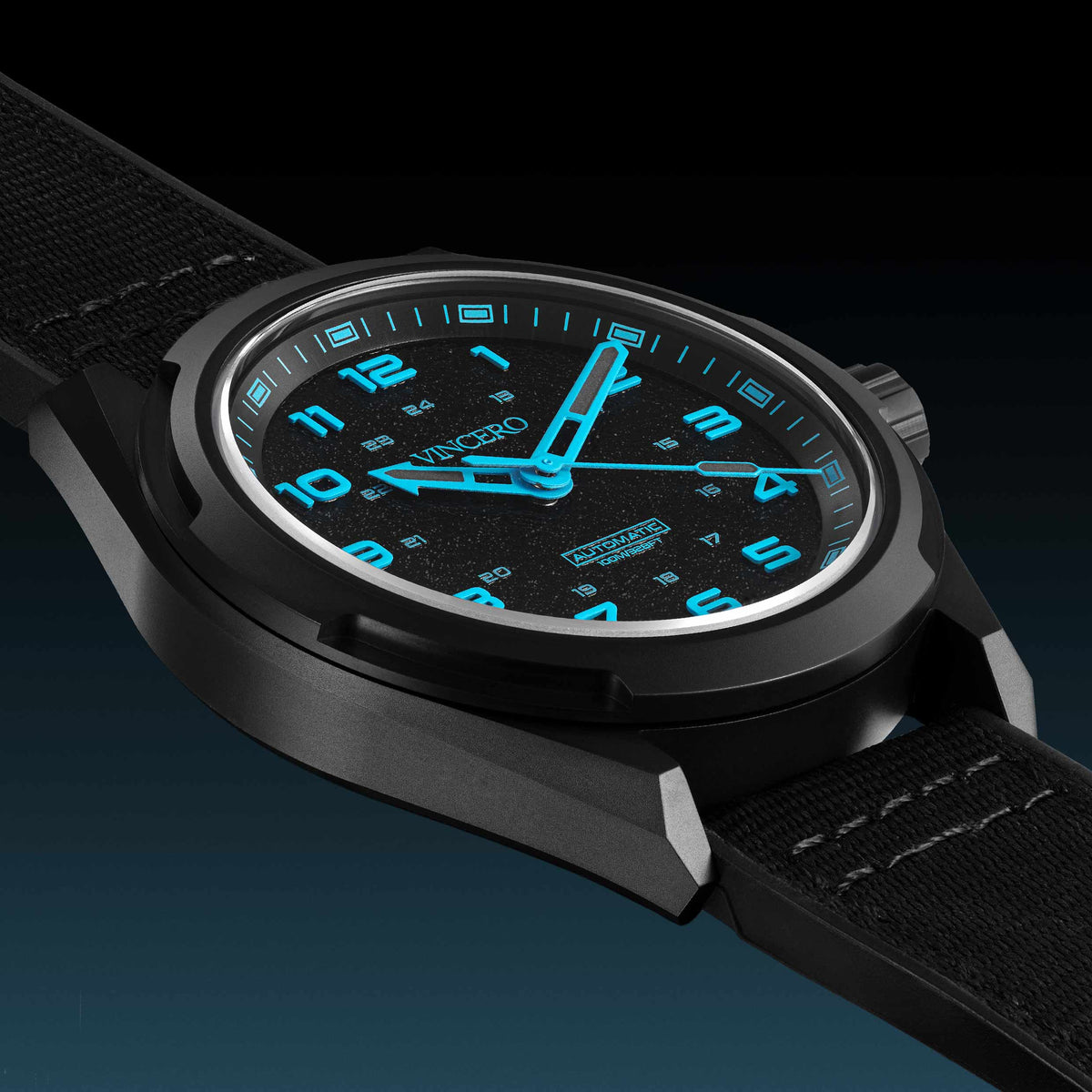 Black wristwatch with blue glowing details on a dark background