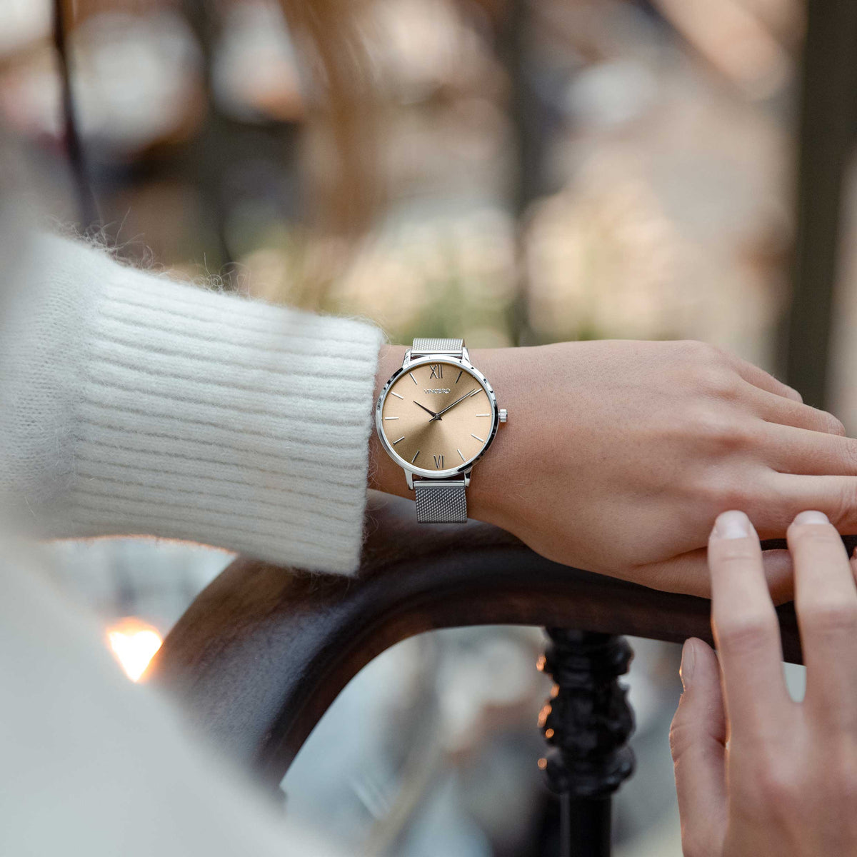 Bronze wrist watch on wrist
