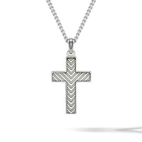A sterling silver cross pendant necklace with a textured chevron pattern, suspended from a matching silver ball chain against a white background.