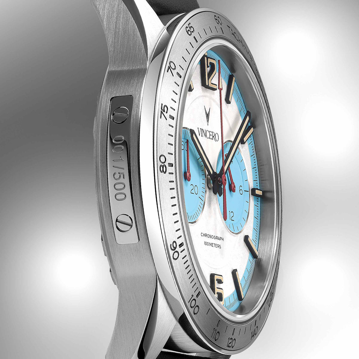 Silver watch with blue face on a gray background