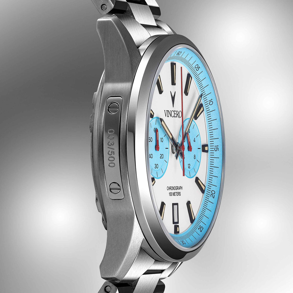Silver wristwatch with a blue face on a gray background