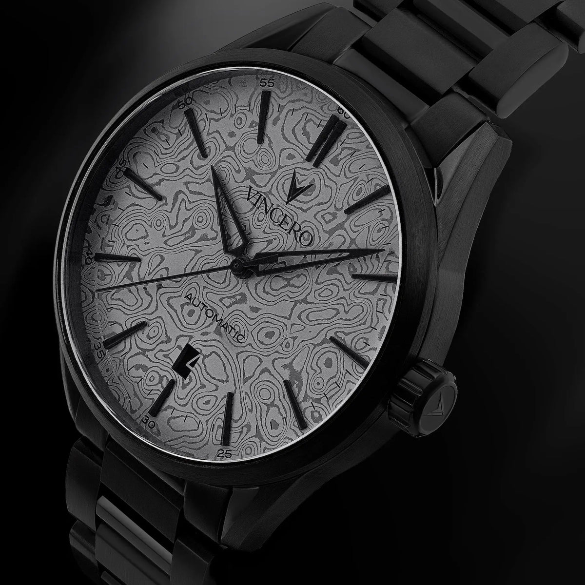 Black wristwatch with detailed face on a dark background
