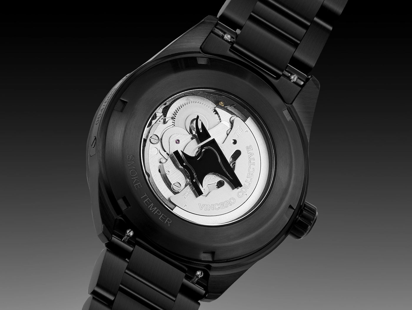 Black watch with visible mechanical components on a dark background