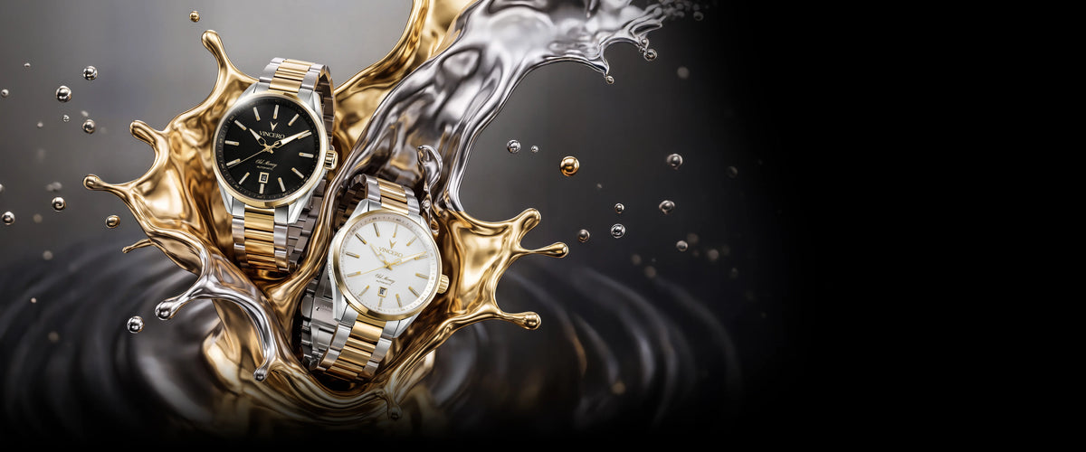 Two wristwatches with gold and silver metal bracelets and black and white dials, emerging from a dramatic gold and silver liquid splash against a dark background.