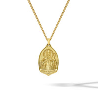Gold necklace with a Saint Peter pendant on a white background