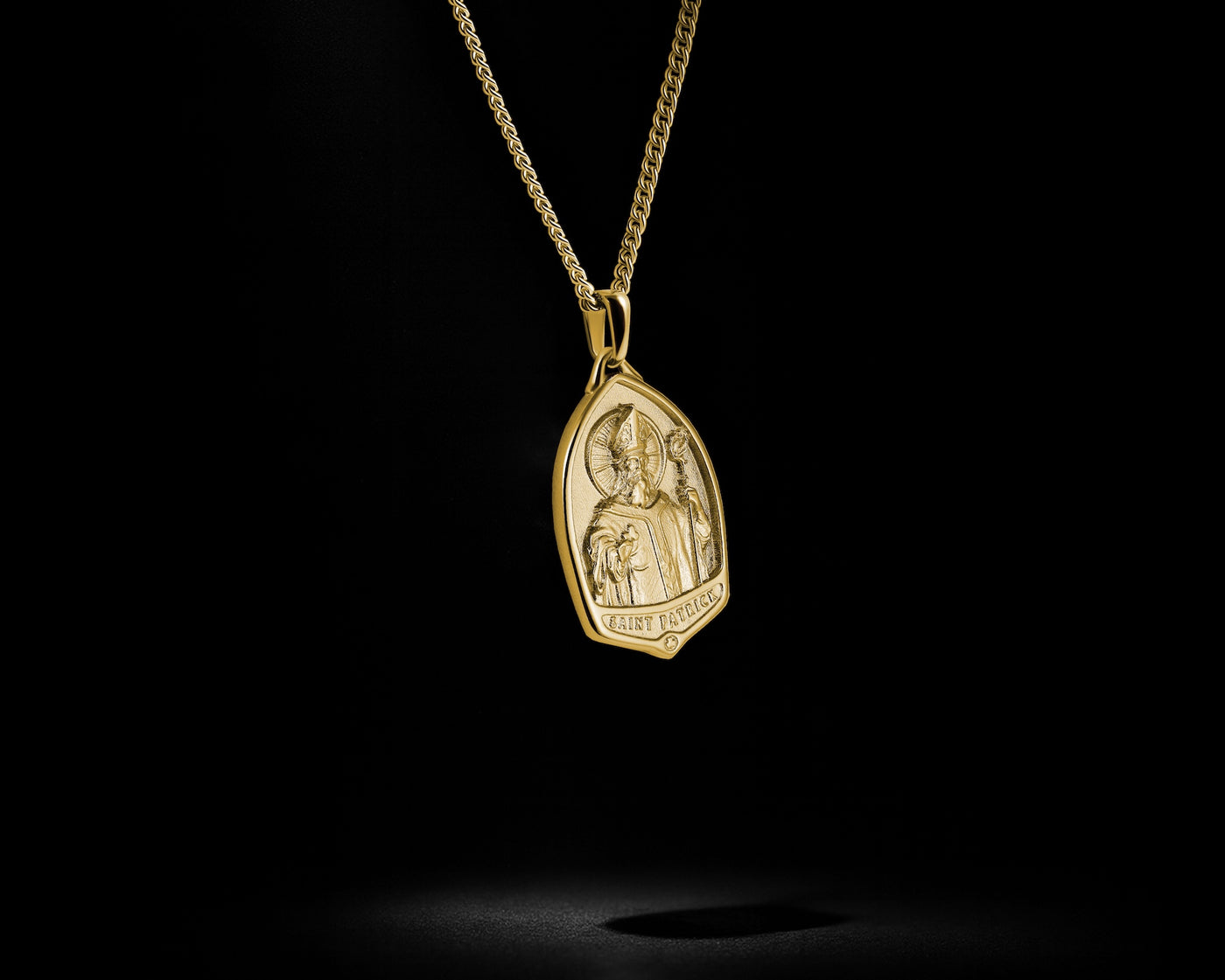 Gold pendant necklace with a dark background