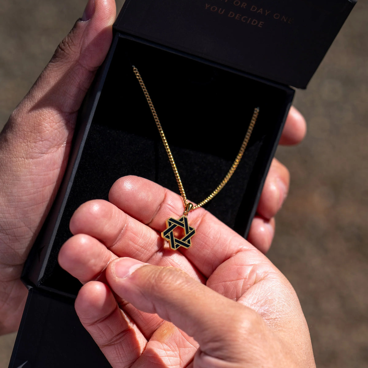 Gold chain necklace with a Star of David pendant