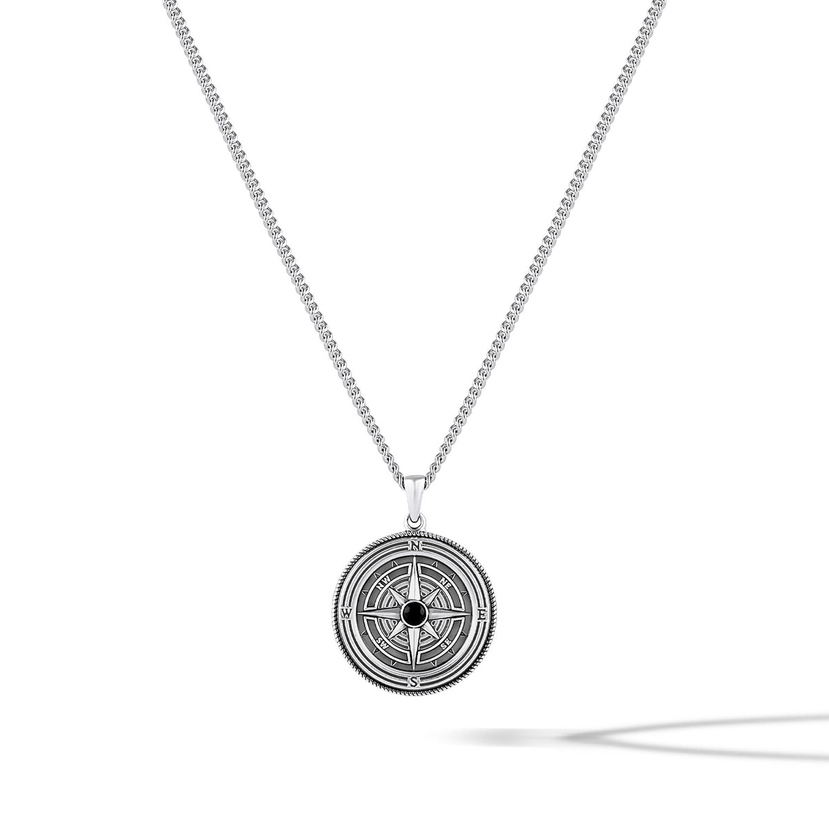 Silver compass pendant necklace on a white background