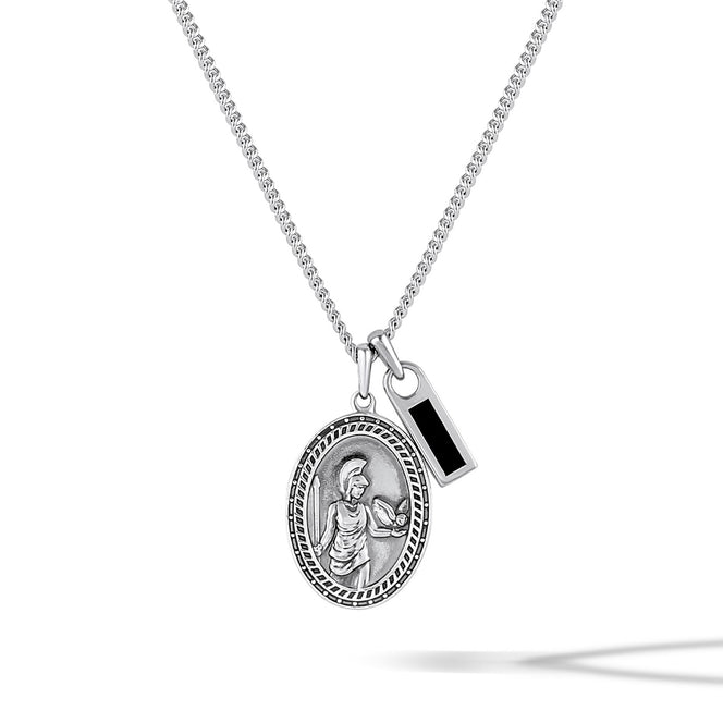 Silver necklace with two pendants on a white background